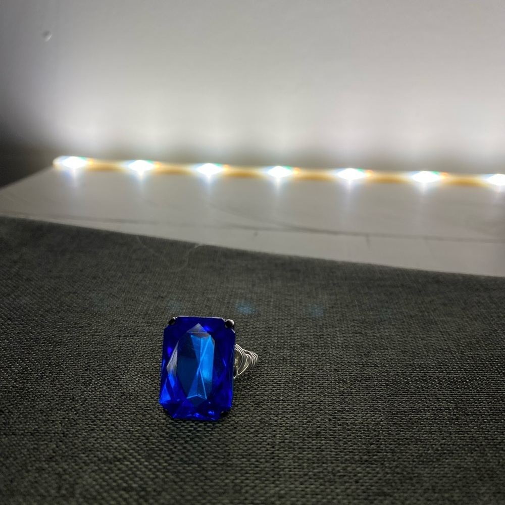 Homemade statement ring.  Single blue gem with wire band